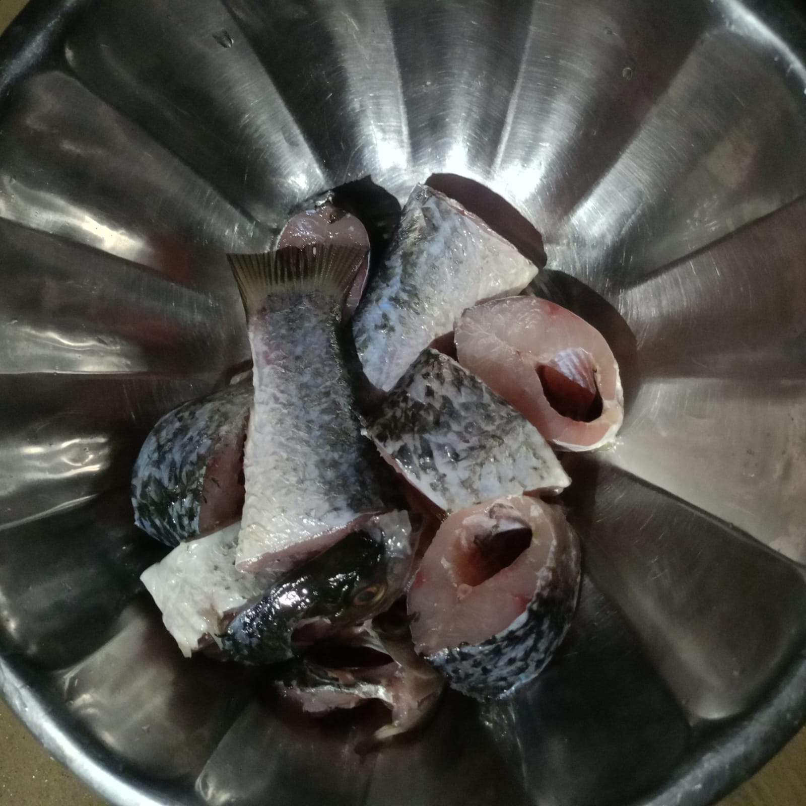 Cleaned and cut fish pieces for Macher Jhol